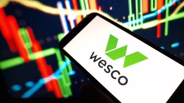 Konskie, Poland - December 23, 2024: Wesco International company logo displayed on mobile phone clipart