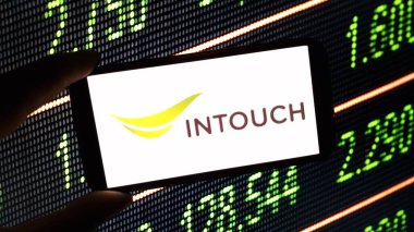 Konskie, Poland - December 24, 2024: Intouch Holdings PCL company logo displayed on mobile phone clipart