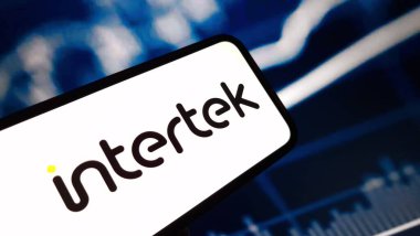 Konskie, Poland - December 24, 2024: Intertek company logo displayed on mobile phone clipart