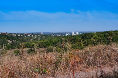 Beautiful sunset in Tunnel Beam Park, Dnipro, Ukraine. Golden sunlight shines through lush trees, capturing the serene atmosphere on September 16, 2025.