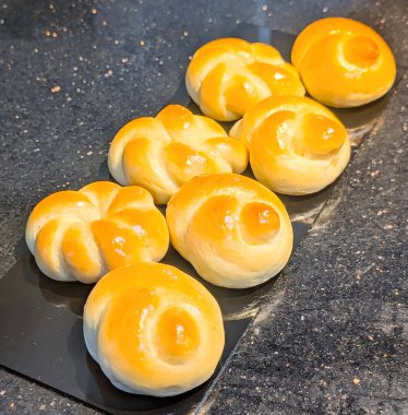 Freshly Baked Soft Dinner Rolls on Dark Background