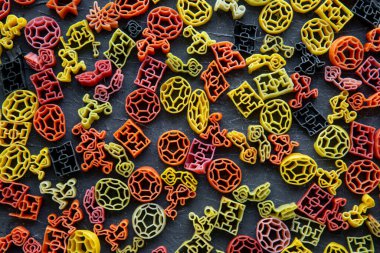 Assortment of different kind of dry pasta background, top view. Colorful pasta. 