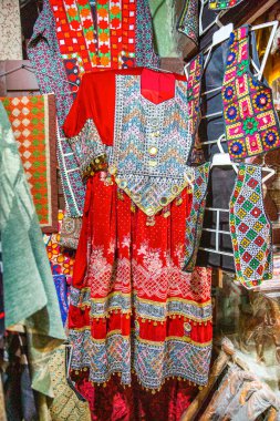Traditional pakistani female clothes, colorful embroidered dress.  clipart