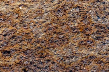 Textured metal surface covered with old rust. Close-up.
