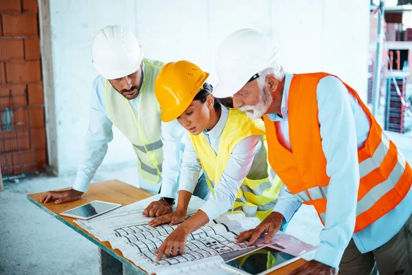 Three Caucasian Engineers Architects Working Blueprint Construction Site — Stock Photo, Image
