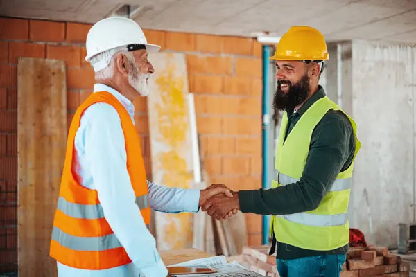 Male Engineers Architects Handshaking Construction Site — Stock Photo, Image