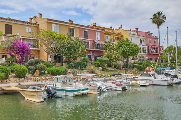 stock image Port Saplaya, Spain - June 4, 2023. Panoramic view of colorfull houses and moored yachts in Port Saplaya, Valencia's Little Venice.