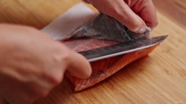 Cook Uses Wide Knife Remove Skin Red Salmon Fillet Cutting — Stock Video