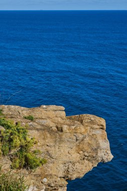 View of the cliff from the observation deck of the Cabo Mayor lighthouse in the city of Santander, Spain. clipart