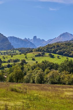 Panoramic view of the valley in front of Picu Urriellu mountain from the viewpoint in Asturias, Spain clipart