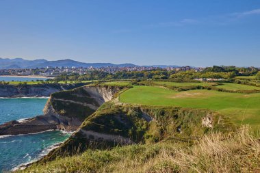 View of the cliff from the observation point of the Cabo Mayor lighthouse in the city of Santander, Spain. clipart