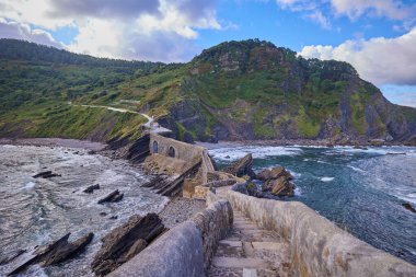 Artificial path to the hermitage of San Juan de Gaztelugatxe island in the Basque Country, Spain. clipart