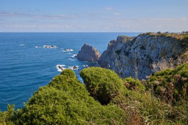 View of the Cantabrian Sea and the rocky steep coast from the observation deck. clipart