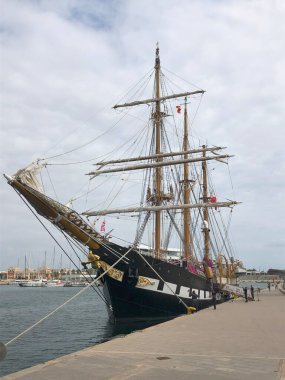 The Italian Navy ship Palinuro is moored at the pier of Valencia. Valencia, Spain - August 25, 2024 clipart