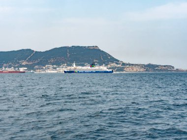 08 August 25 UK, Gibraltar. Ferry from the Africa Morocco Link is crossing in front of Gibraltar from Africa to Europe, The shot is taken in the bay of Algeciras.