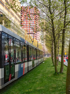 Wide view of an electric tram in Rotterdam, symbolising clean transport and smart urban infrastructure.