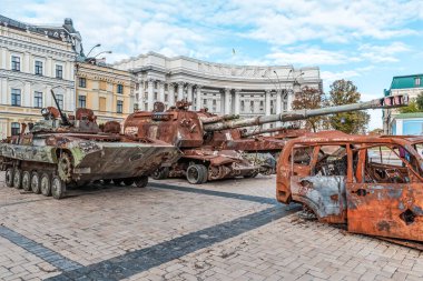 Kyiv, Ukraine - October 27, 2023: Destroyed Russian military vehicles and equipment on display at the Destroyed Russian Military Equipment Exhibition in Mykhailivska Square, Kyiv. This exhibition highlights the aftermath of Russia's invasion of Ukrai clipart