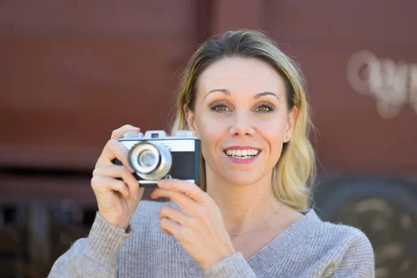 Front View Smiling Middle Aged Woman Holding Old Camera Wearing — Stok fotoğraf