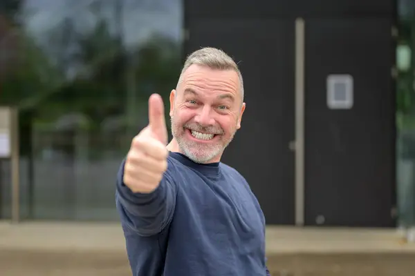 Enthusiastic Motivated Attractive Middle Aged Man Giving Thumbs Gesture Approval Stock Photo