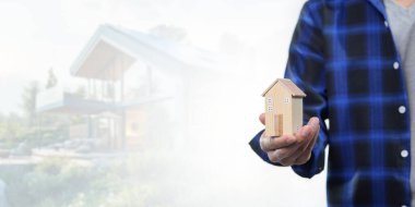 Bu resimle bir model ev satın alma, satma ve kiralama kavramını araştırın. Emlakçılar ve alıcılar için ideal..