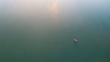 Sand mining platform on the water. Aerial view of an industrial landscape. 