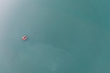 Sand mining platform on the water. Aerial view of an industrial landscape.