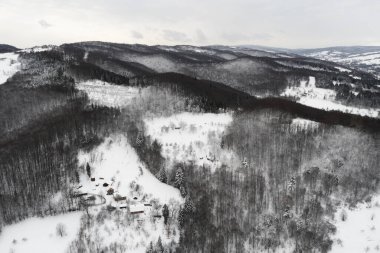 Aerial view of winter mountains. Monochrome color photography. Copy past background or wallpaper.
