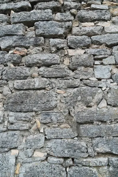 Gri grunge desenli eski taş duvar.
