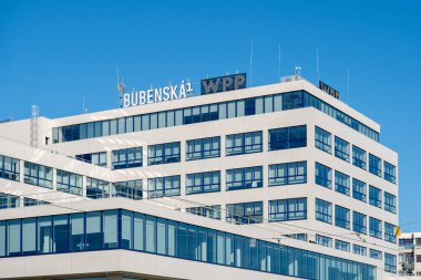 Functionalist building with reinforced concrete construction and creamy white cladding. The interior is dominated by a spacious entrance hall with a distinctive staircase, a functional pater noster and galleries on the upper floors. clipart