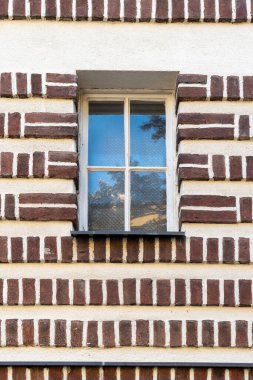 Realization of architect Jaroslav Vondrak in Prague - Dejvice. An apartment building with a striking geometric facade. clipart