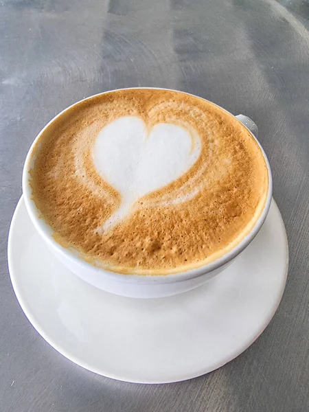 Colombia, Medellin, May 20, 2023, cup with cappuccino with heart-shaped milk foam