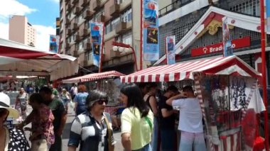 Sao Paulo, SP, Brazil - December 31, 2022: open air fair of Liberdade neighborhood. People selling handicrafts and plants at Liberdade square.