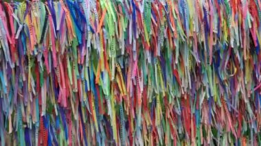 Porto Seguro, BA, Brazil - January 03, 2023: colored ribbons, called Fitinhas, hung in the belvedere of the chapel, at the Historic Center of Porto Seguro.