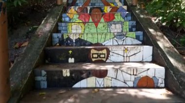 Arraial d'Ajuda, Porto Seguro, BA, Brazil - January 04, 2023: Escadaria da Santa staircase, an staircase decorated with colored pieces of tiles with 146 steps, tribute to Nossa Senhora d'Ajuda.
