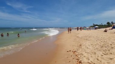 Trancoso, district of Porto Seguro, BA, Brazil - January 06, 2023: walking on Nativos beach, a beautiful beach in northeastern Brazil. Tourist destination of Trancoso.