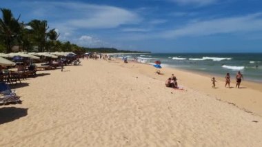 Trancoso, district of Porto Seguro, BA, Brazil - January 06, 2023: people at Nativos beach on a sunny day, a beautiful beach in northeastern Brazil. Tourist destination of Trancoso.