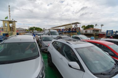 Porto Seguro, BA, Brazil - January 04, 2023: cars on the ferry crossing between Porto Seguro and Arraial d'Ajuda, Bahia state - Brazil. clipart