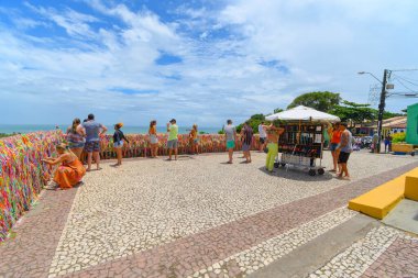 Arraial d'Ajuda, district of Porto Seguro, BA, Brazil - January 04, 2023: people on the belvedere of Arraial d'Ajuda, behind the church at the Historic Center.