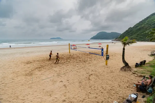 stock image Guaruja, SP, Brazil - April 11, 2024: people playing footvolley on Tombo Beach.