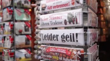 BERLIN, GERMANY - DEC 26, 2021: Postcards, funny slogan, fashion print. The funny inscription can be used on postcards, posters, banners, decorative prints for sale at Christmas markets