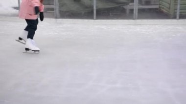 ice rink, frosty weather, Enjoying winter. Ice skating on an ice rink in the winter, fun, vacation, Christmas market in Berlin, Germany on winters day