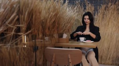 adding sugar, preparing coffee, unhealthy nutrition. Preparation of classic coffee in the mocha, sugar is poured into the small cups, coffee break, morning habit.