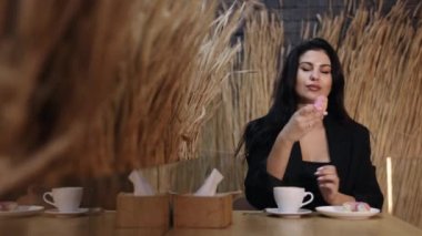 pink donut, imbalanced nutrition, junk food. Pretty girl eating a donut, diet breakdown, cheat meal, and imbalanced nutrition concept involved.