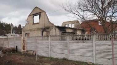 Ukrainian refugees, Buildings destroyed, ruins of house. In aftermath of bombing destroyed building, war in Ukraine, collapsed building disaster scene full of debris, dust, damage to house, bombing.