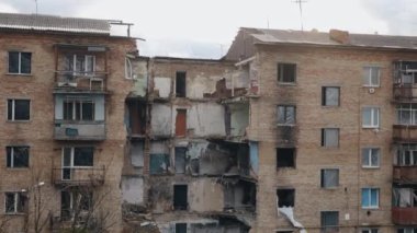 destroy city, Buildings destroyed, Disaster scene. During war in Ukraine, building collided. Scene was full of debris, dust, damaged houses. Aftermath of bombing