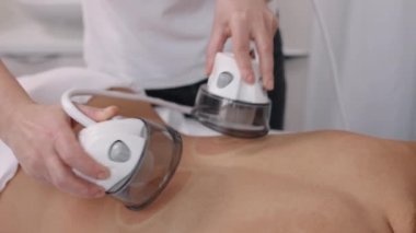 Anti-cellulite, Vacuum massage, medical procedures. Anti-cellulite roller vacuum massage in medicine salon. Slim problem areas, special body care professional equipment, perform lpg massage procedure