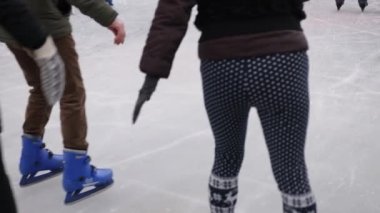 frosty weather, ice-skating, outdoor activities. During winter, people tend to ice skate on ice rink during winter, seasonal fun, holiday, traditional Christmas market in Berlin during winter months