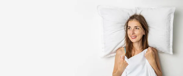 Smiling Young Woman Lies Covered Sheet Top View Flat Lay — Stock Photo, Image