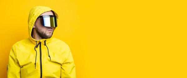 Young Man Cyberpunk Glasses Yellow Jacket Looking Away Yellow Background — Stock Fotó