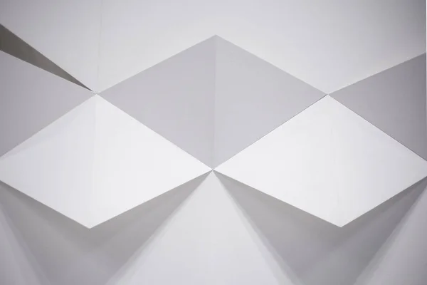 White abstract geometric background with triangles, decorative wall.